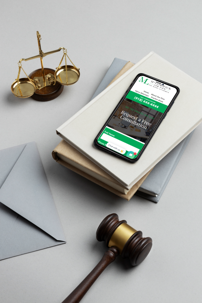 Contact us image, with McCormick Law Firm website on phone